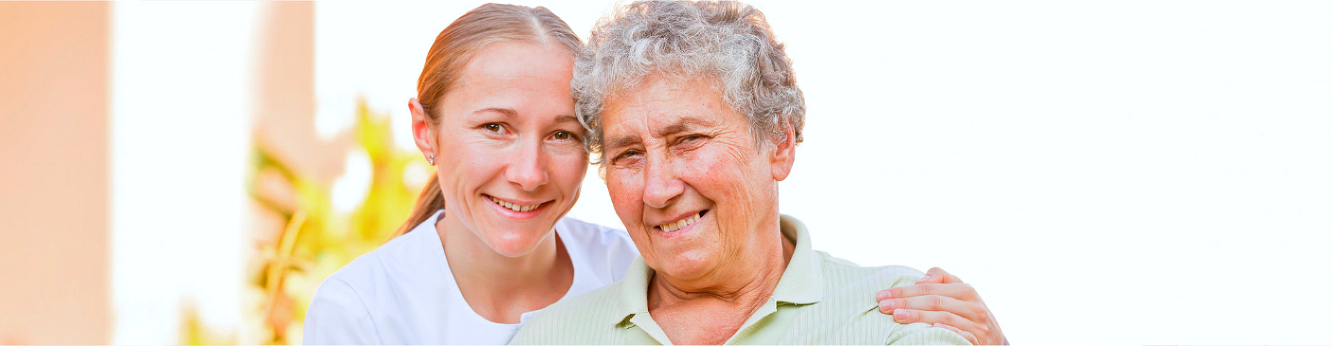 elderly woman with her caregiver